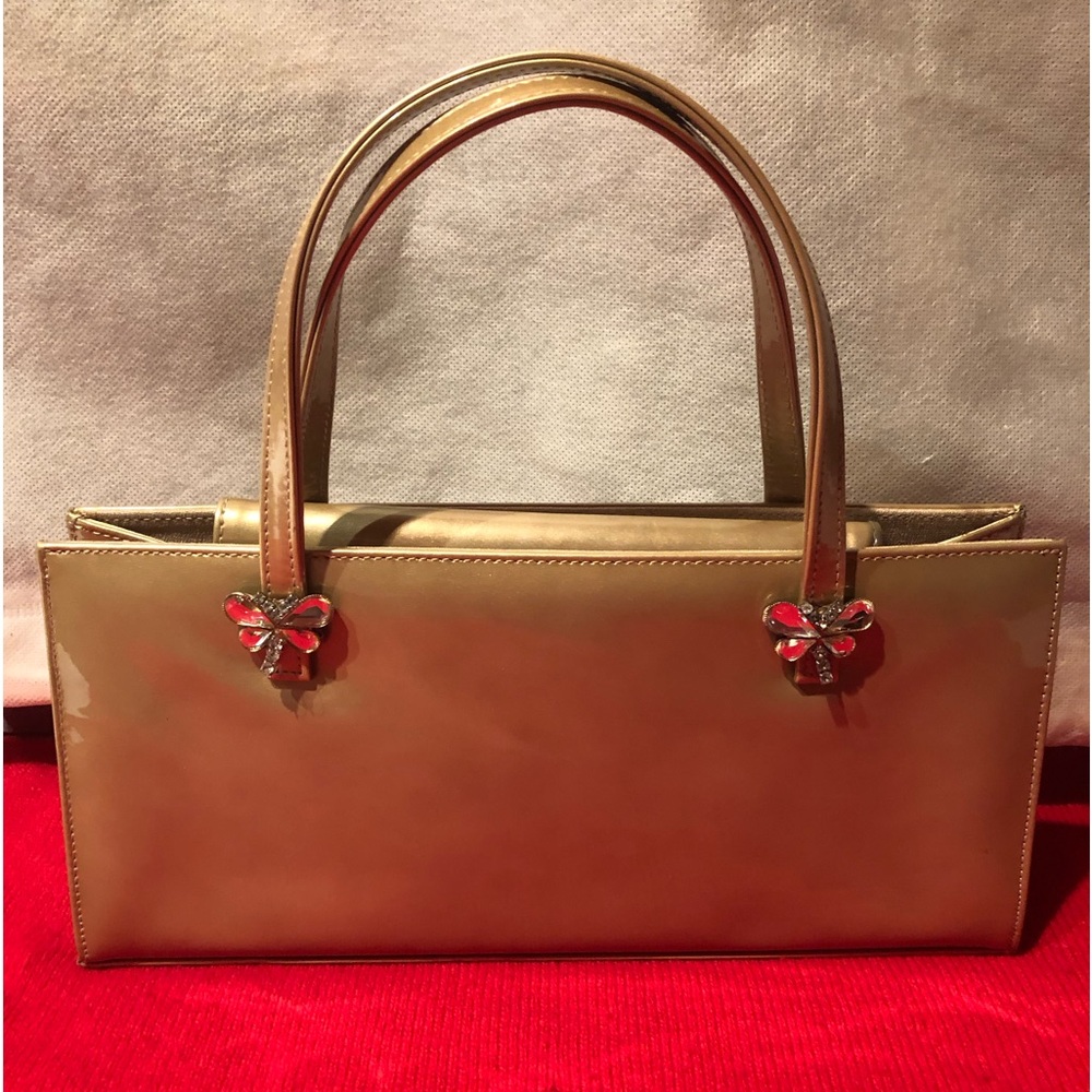 Classy Stuart Weitzman gold patent leather handbag w/ crystal butterfly detail